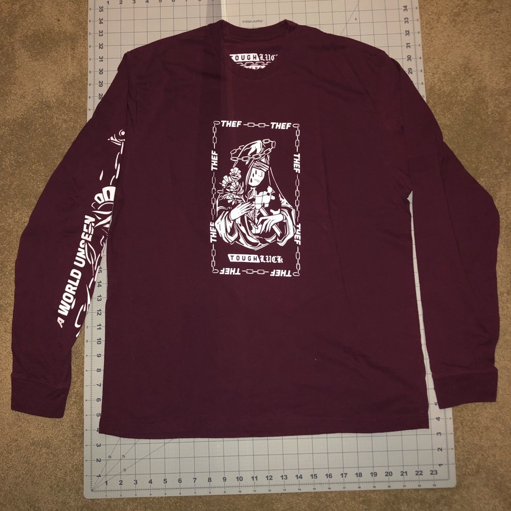 Tough Luck. Size extra large. Maroon color. Long sleeve shirt.